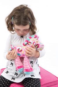 child with stuffed animal